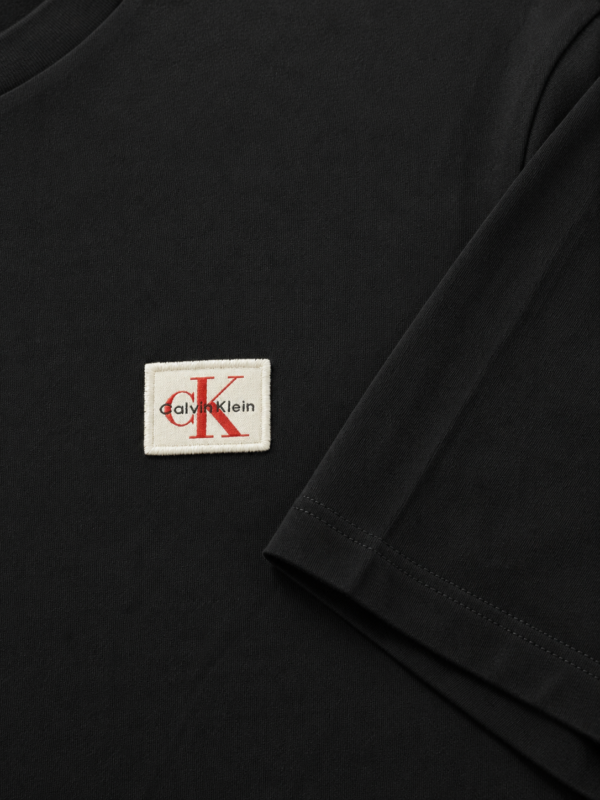 Muška majica - Calvin Klein Jeans - crna sa CK aplikacijom
